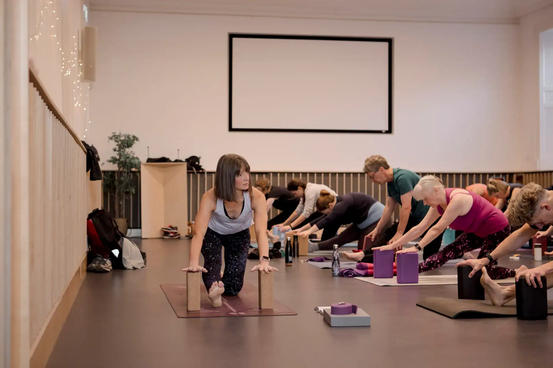Group Pilates class focusing on flexibility and strength training.